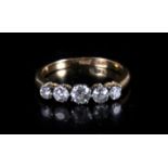 An 18ct gold five stone diamond ring. Approx UK size L Approx total .70pt carat of diamonds