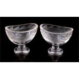 A pair of 19th century cut glass sweetmeat dishes, possibly Irish, 9.5cms (3.75ins) high.