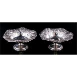 A pair of silver pedestal dishes with embossed Art Nouveau pansy decoration, Birmingham silver