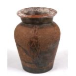 An English pottery jar with sgraffito crowned lion decoration, 18cms (7ins) high.