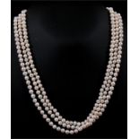 A long 'flapper' style cultured pearl necklace. approx 160cm (63ins) long