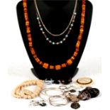 A quantity of jewellery, to include Scottish hardstone and silver; an amber necklace; and other
