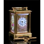 A miniature brass carriage clock with floral decorated porcelain panel sides. The lavender porcelain