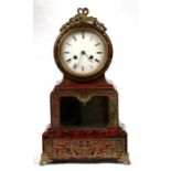 An early 19th century boulle-work mantle clock, the white enamelled dial with Roman numerals, the