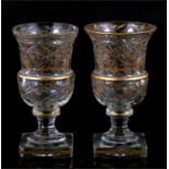 A pair of late 19th century French cut glass goblets, the thistle shaped bowls cut with circular