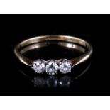 An 18ct gold ring set with three diamonds Approx UK size N 1/2