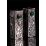 Two Continental silver lipstick holders with spring action mirrors and green cabochon stones