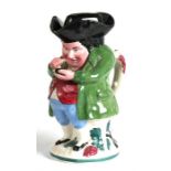 A 19th century Staffordshire pottery character jug and cover, the Snuff Taker, wearing a green