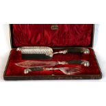 Victorian EPNS antler handled fish server and crumb scoop, set in red plush lined leather case.