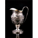 A Georgian embossed silver milk jug, London 1793, 14.3cm (5.75ins) high, 254gms.​ Condition Report