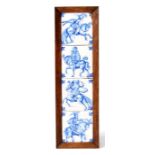 Set of four Delft tiles, framed as one, decorated with figure on horseback.  Each tile 13cm by