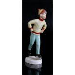 Royal Worcester figure, Tuesday’s child no.3534, a boy ice skater in yellow jumper. 20.5cm (8ins)