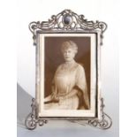 A silver strut photo frame, dated Birmingham 1897, containing a signed photo of Queen Mary, 14.5