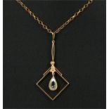 An Art Nouveau 9ct gold pendant on chain, central pale blue stone suspended below seed pearls