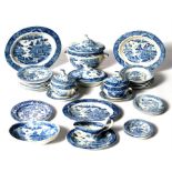 An early 19th century miniature blue & white dinner service, to include tureens, gravy boat,