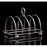 A Georgian silver four division toast rack, dated London 1793, makers mark for Digby Scott and
