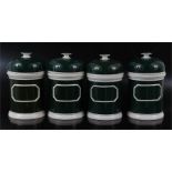 Set of four late19th early 20th century green and white pottery chemist jars with dome lids and
