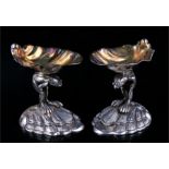 A pair of gilt & silver plated Garrard & Co. shell and frog table salts, 9cms (3.5ins) high.