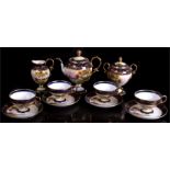 Noritake 11 piece tea set, decorated with landscape scenes within a blue & gilt boarder. Condition