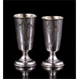 A pair of Russian silver vodka 'stopka' cups, Moscow 1899-1908 with indistinct maker mark. 7cm (2.