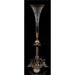 A Victorian silver plated and cut glass single flute epergne on winged dragon supports with leaf and