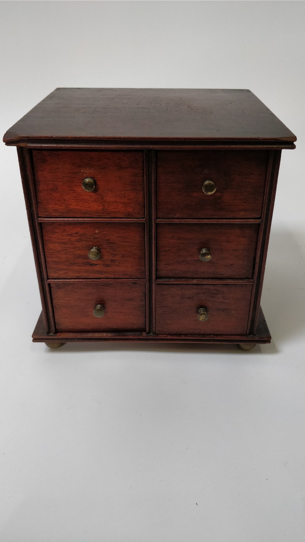 An early 20th century apprentice chest of drawers, with six small fitted drawers each with a brass - Image 2 of 2