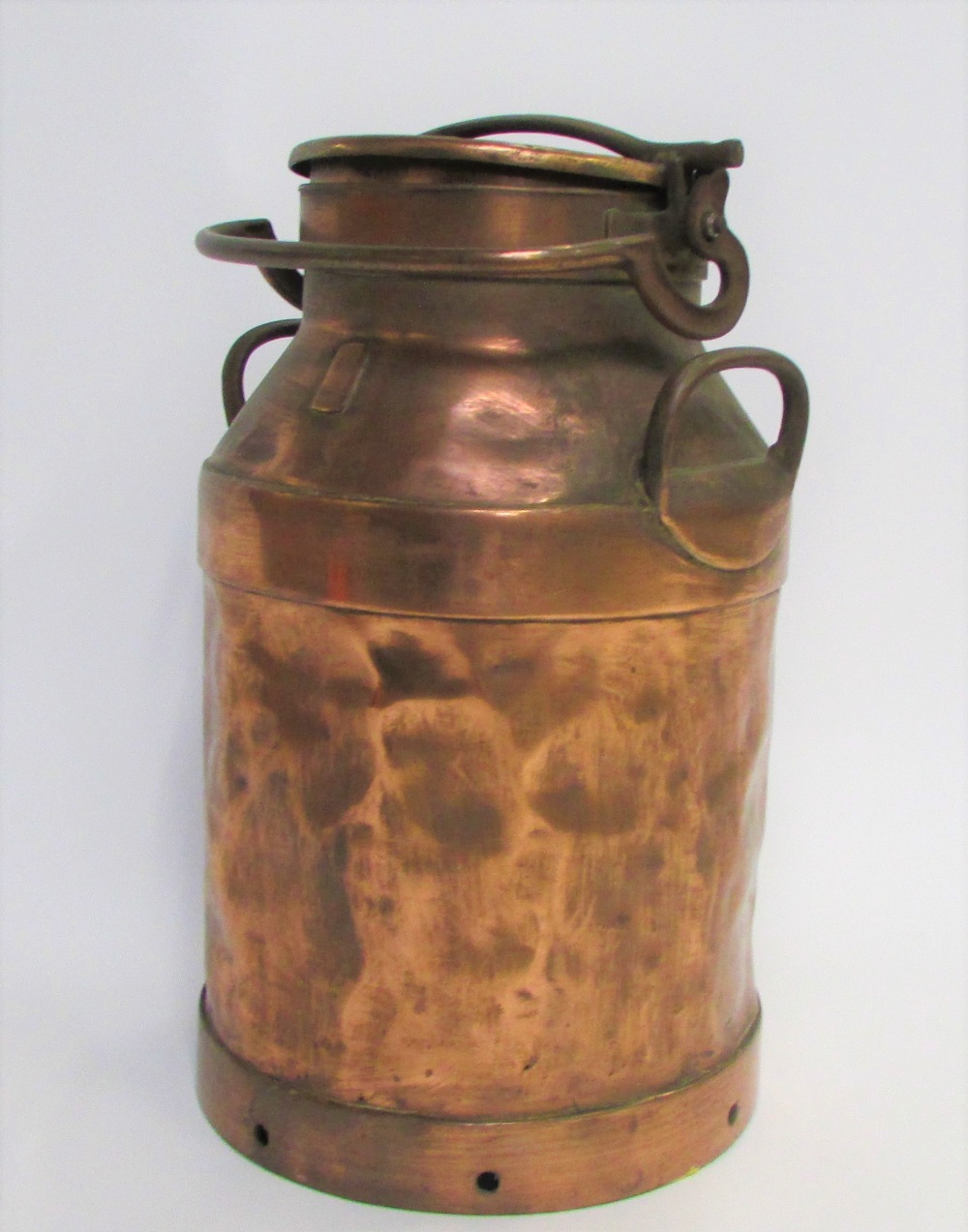 An early 20th century copper milk churn