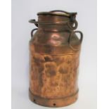 An early 20th century copper milk churn