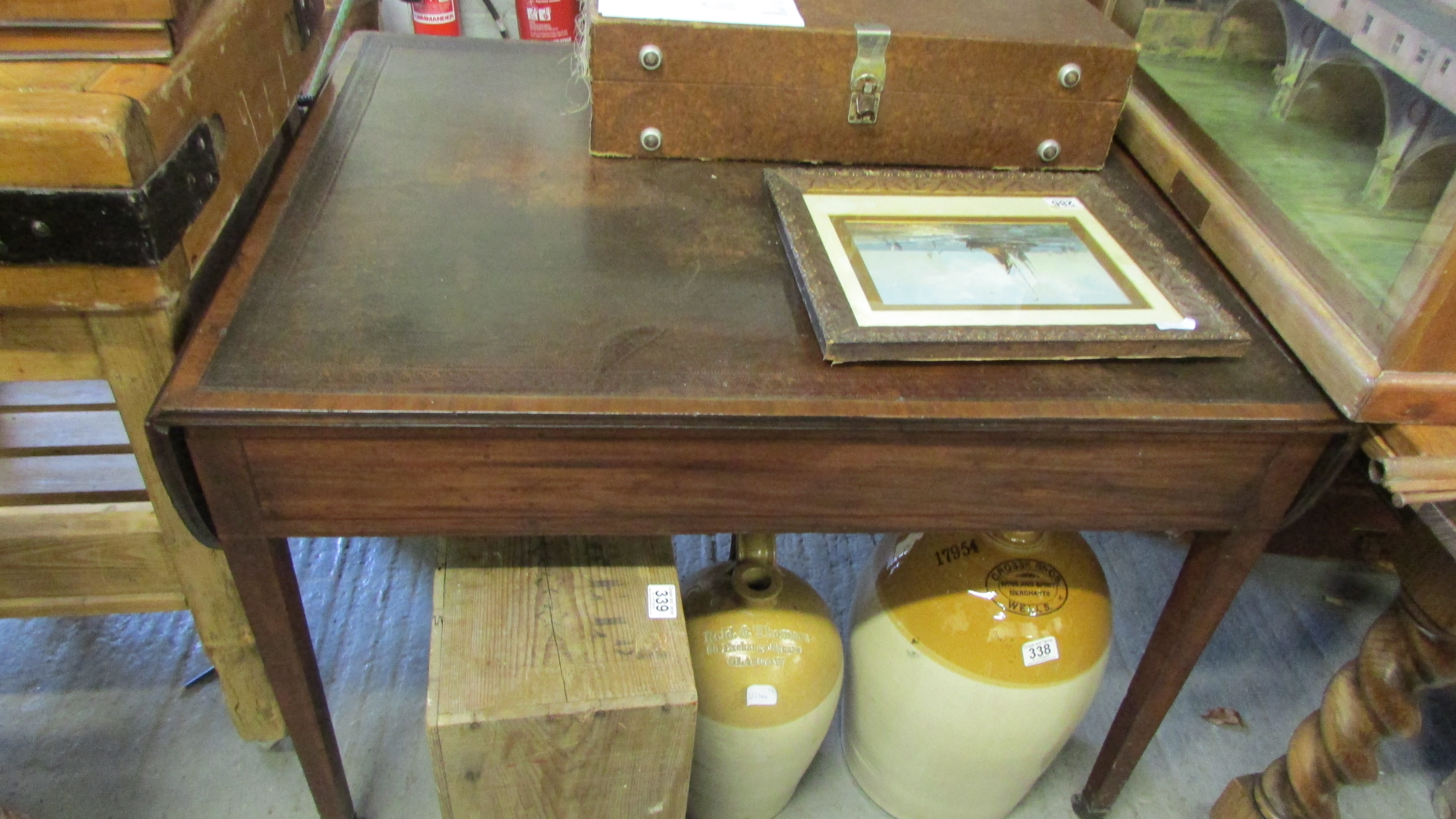 A Georgian writing desk with inlaid leather, drop leaf ends, on tapering legs and three lockable - Image 9 of 10