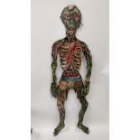 A 20th century wooden standing figure of a Zombie, purportly from a ghost train, 177cm high