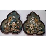 A pair of early 20th century Chinese plaques, each carved in relief in bone of a female figure