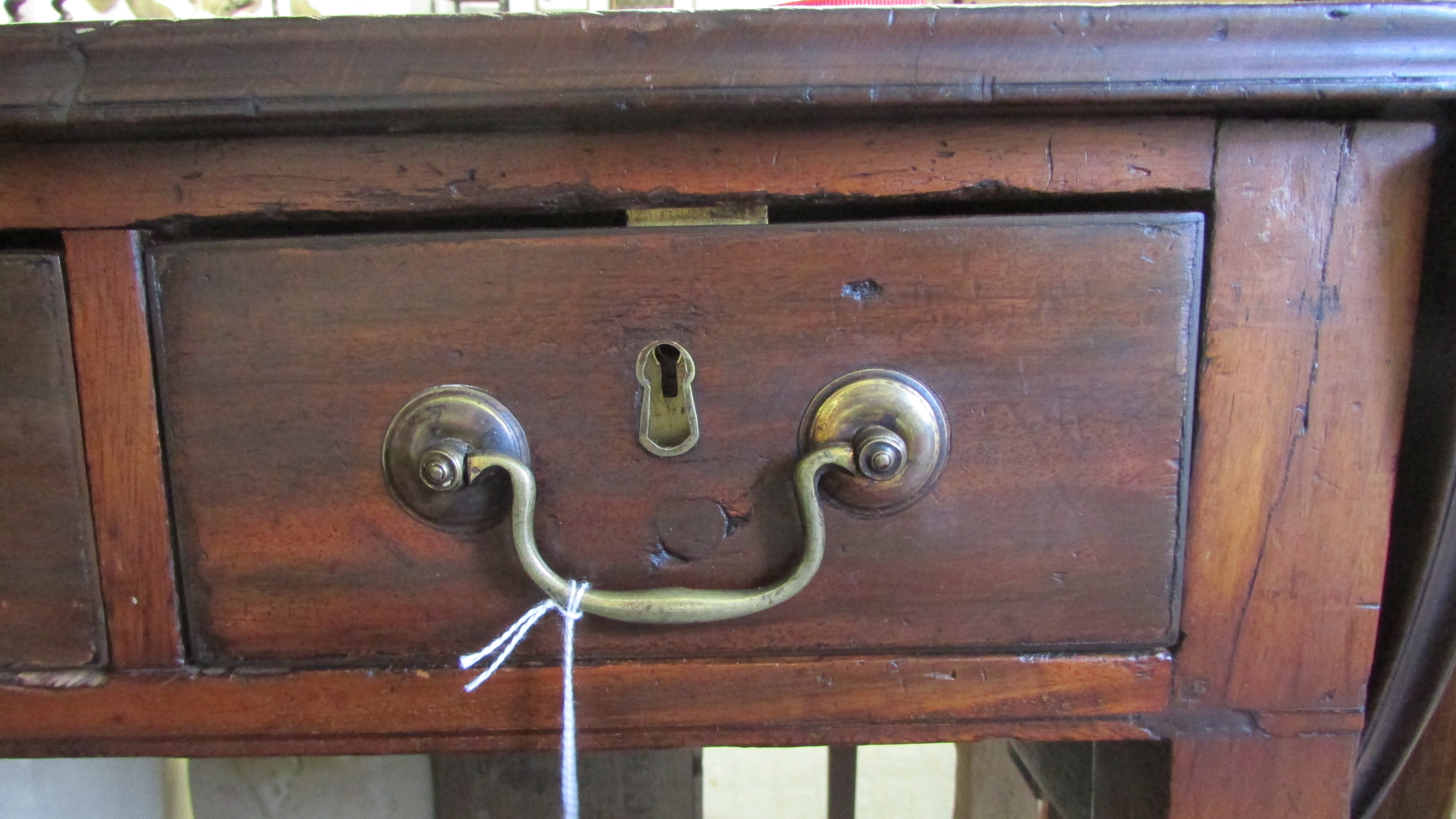 A Georgian writing desk with inlaid leather, drop leaf ends, on tapering legs and three lockable - Image 2 of 10