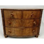 A 20th century bow front chest of drawers, of two short and two long, with a barley twist boarder,