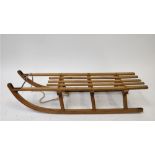 A 20th century hardwood sledge, stamped Davos