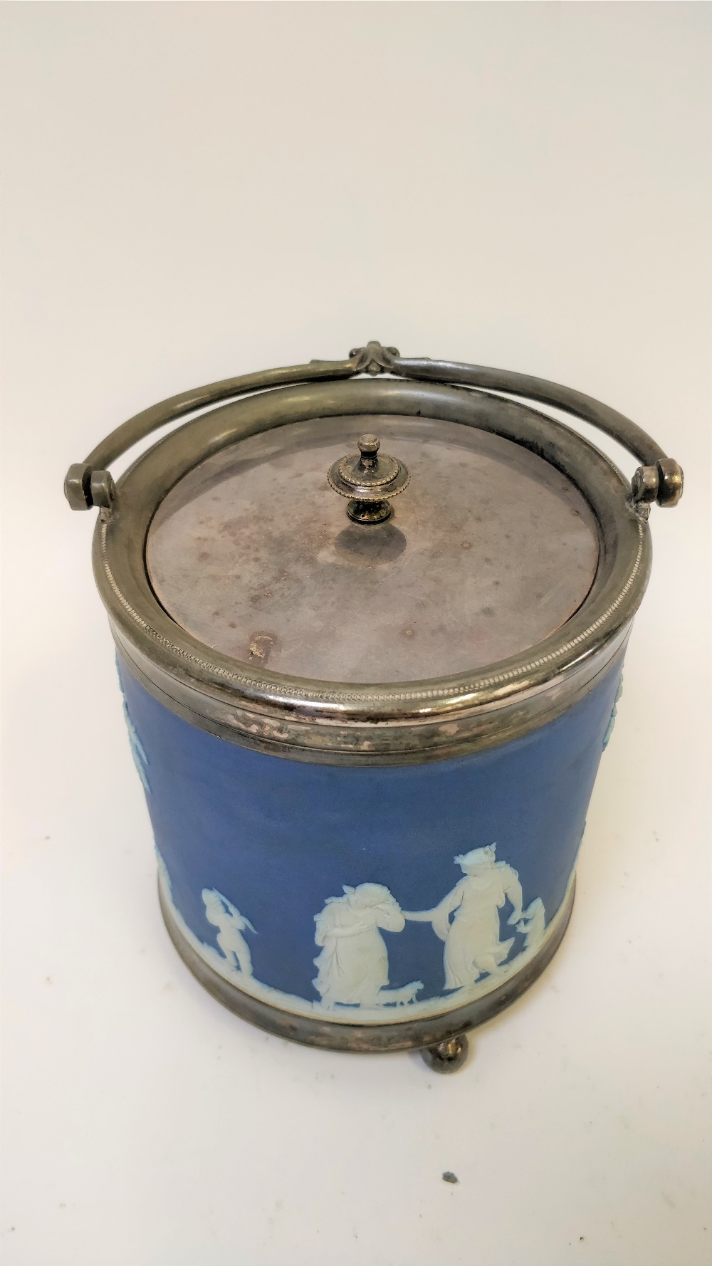 A Wedgwood blue jasperware biscuit barrel, decorated various figures, impressed marks, 15cm high - Image 2 of 2