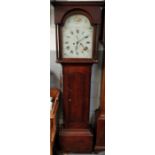 A longcase clock in a mahogany case, with a painted face and eight movement