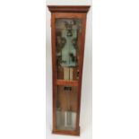 A 20th century postal electric clock in an oak case, by Magneta 36 BK 65/6