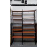 A 1970's ladder shelving unit, with 12 adjustable shelves, 221cm high, 140cm wide, 35cm deep