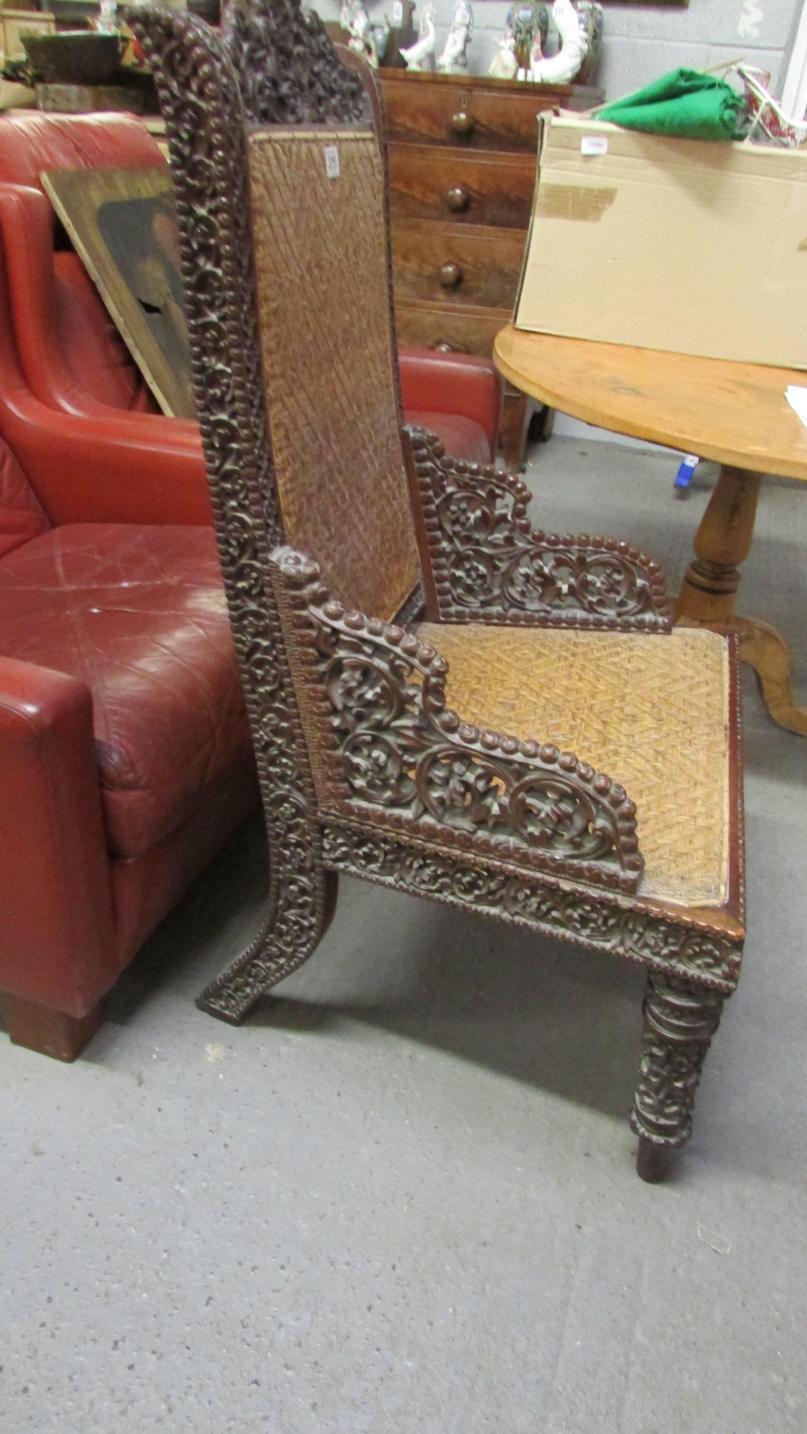 A 19th century Anglo Indian carved hardwood chair with a wicker seat and back - Image 2 of 7