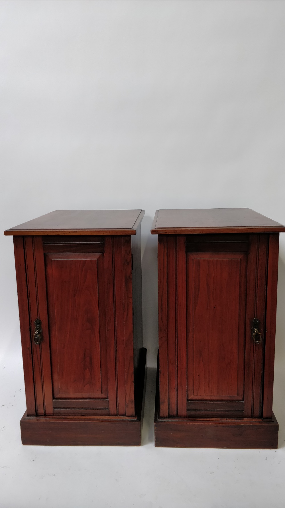 A pair of 20th century mahogany pot cupboards, each with adjustable shelf, 72cm high, 39cm long,