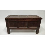 A 19th century oak coffer, with plain front panels, hinged lid, 53cm high, 104cm long