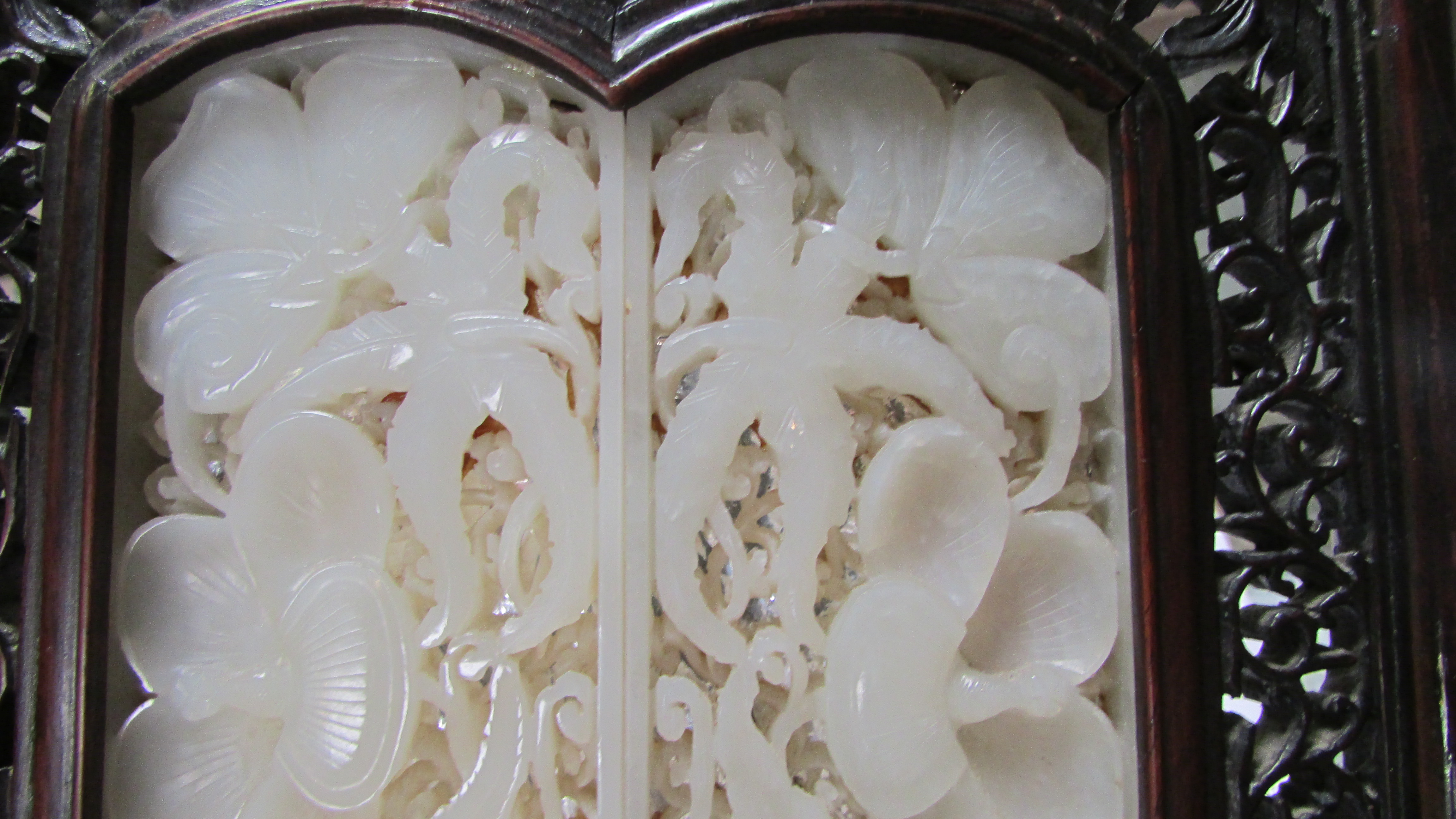 A 20th century Chinese table screen, the white jade panel decorated with flowers in a hardwood frame - Image 3 of 7