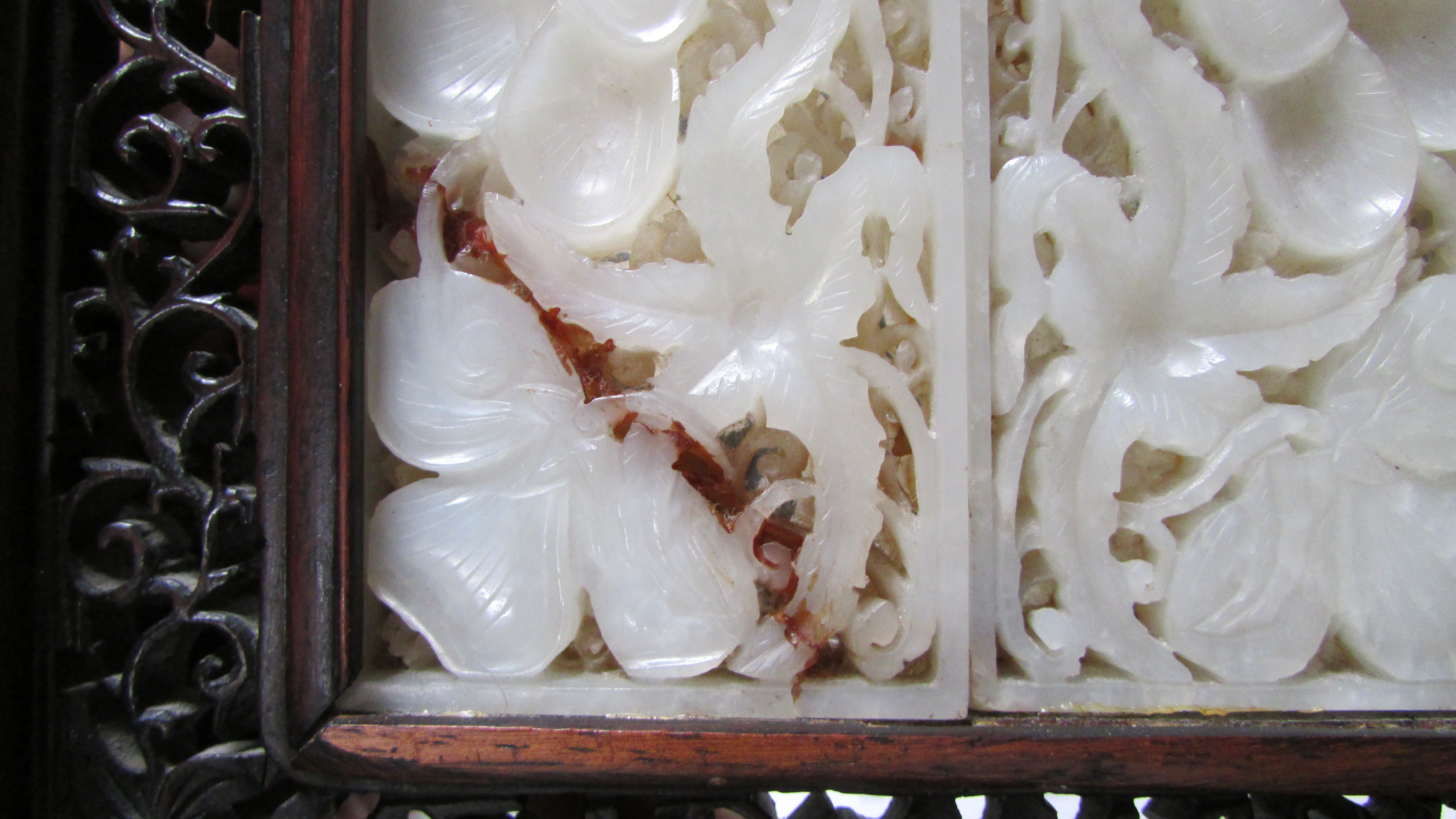 A 20th century Chinese table screen, the white jade panel decorated with flowers in a hardwood frame - Image 2 of 7