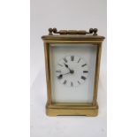 A 20th century carriage clock, white enamel face and roman numerals