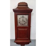 A 1930's mahogany cased wall clock, with a silvered dial