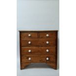 A 20th century pine chest of drawers of two and three long, with white ceramic handles, 108cm
