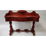 A mahogany serpentine dressing table, with a single drawer, 83cm high, 108cm long, 43cm wide