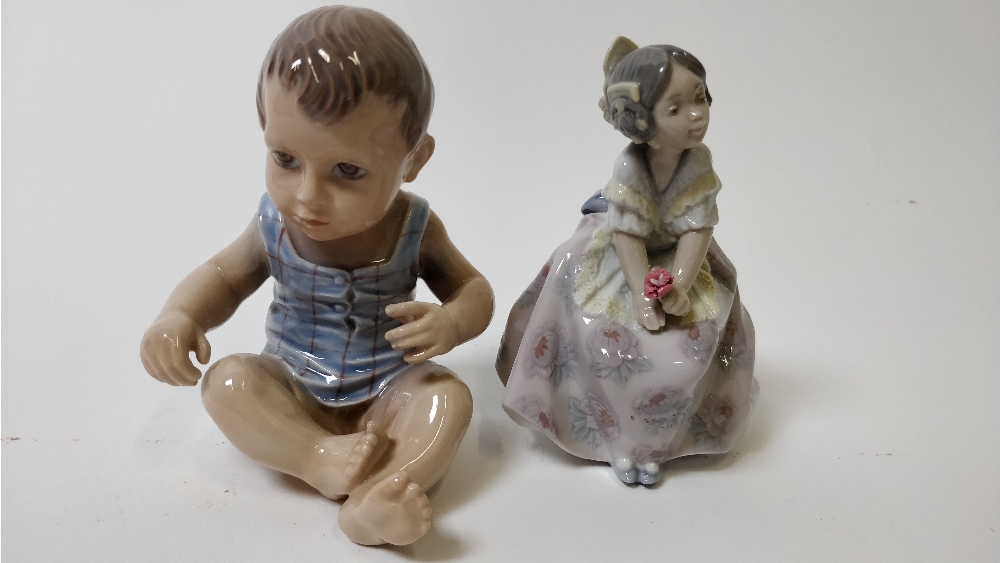 A Dahl & Jensen figure of a baby boy, along with a Lladro figure of a girl