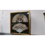 Two framed hand painted fans, each painted with a classical scene, in gilt frame