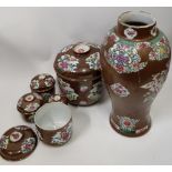 A Chinese six piece ceramic set comprising one single vase and five storage jars and covers,